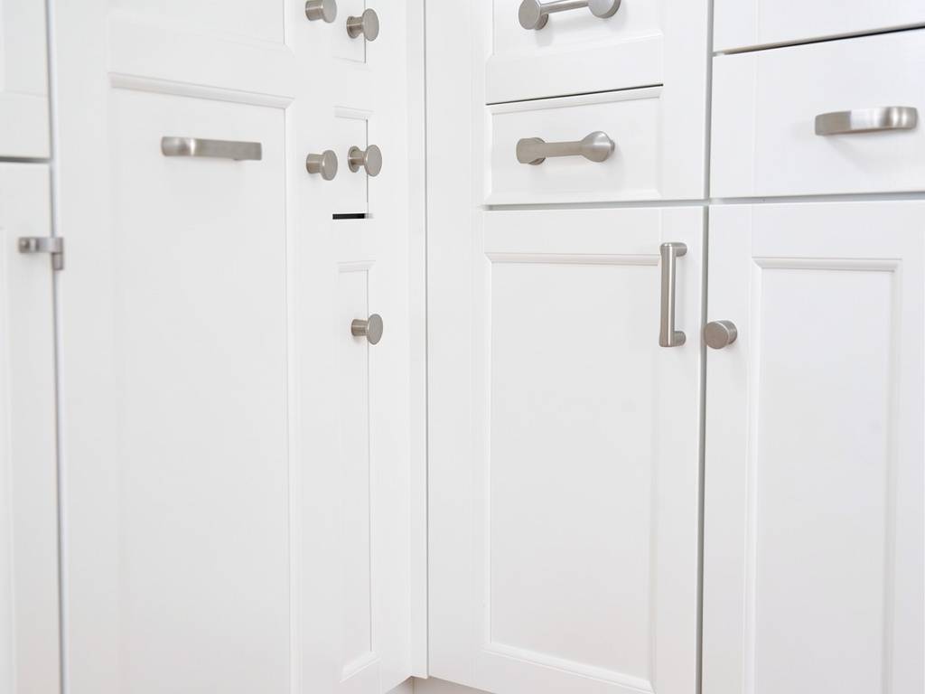different cabinet pull sizes on a kitchen cabinet row white shaker kitchen cabinets with modern brushed nickel pulls in different lengths